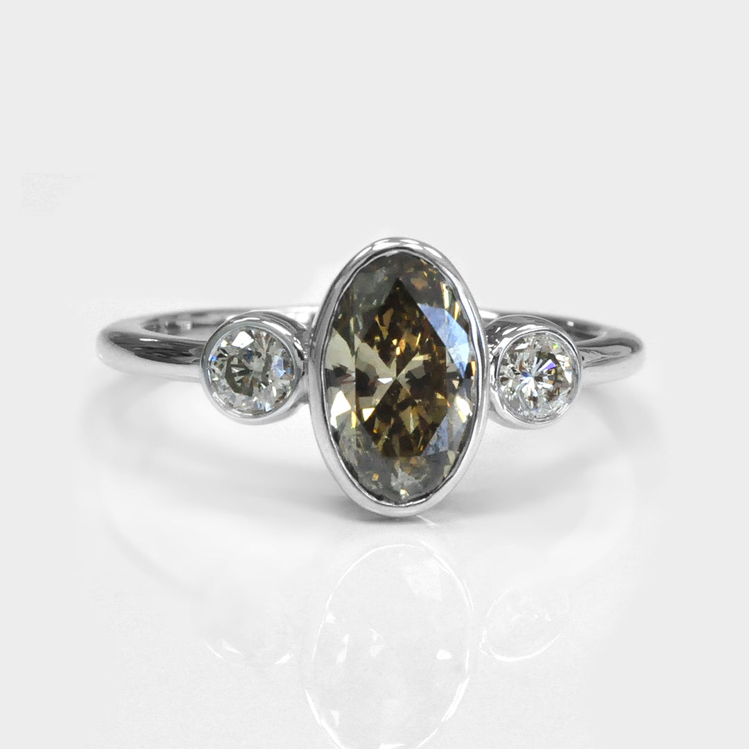 Bezel Set Three Stones Oval & round diamonds Ring