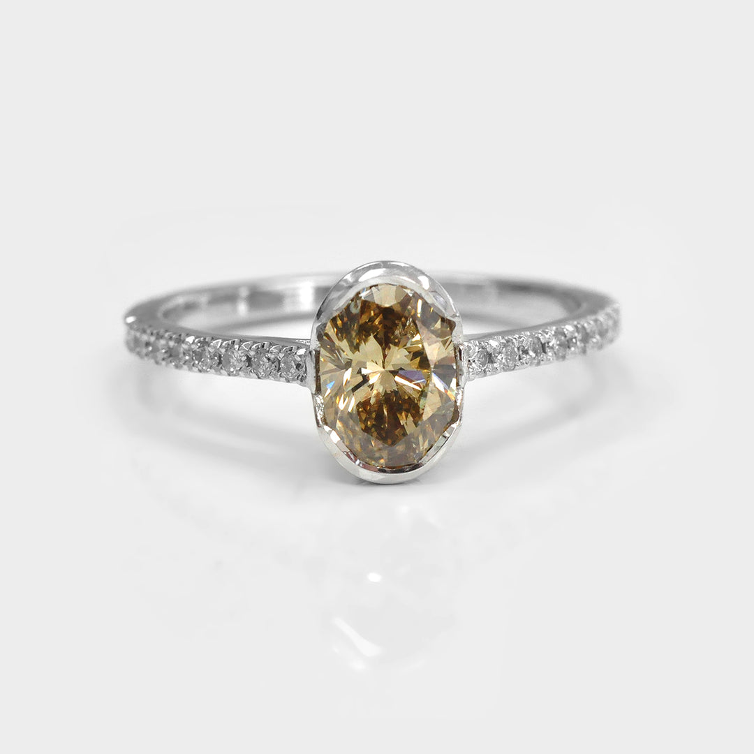 Oval Yellowish Brown half Bezel Setting Diamonds Ring