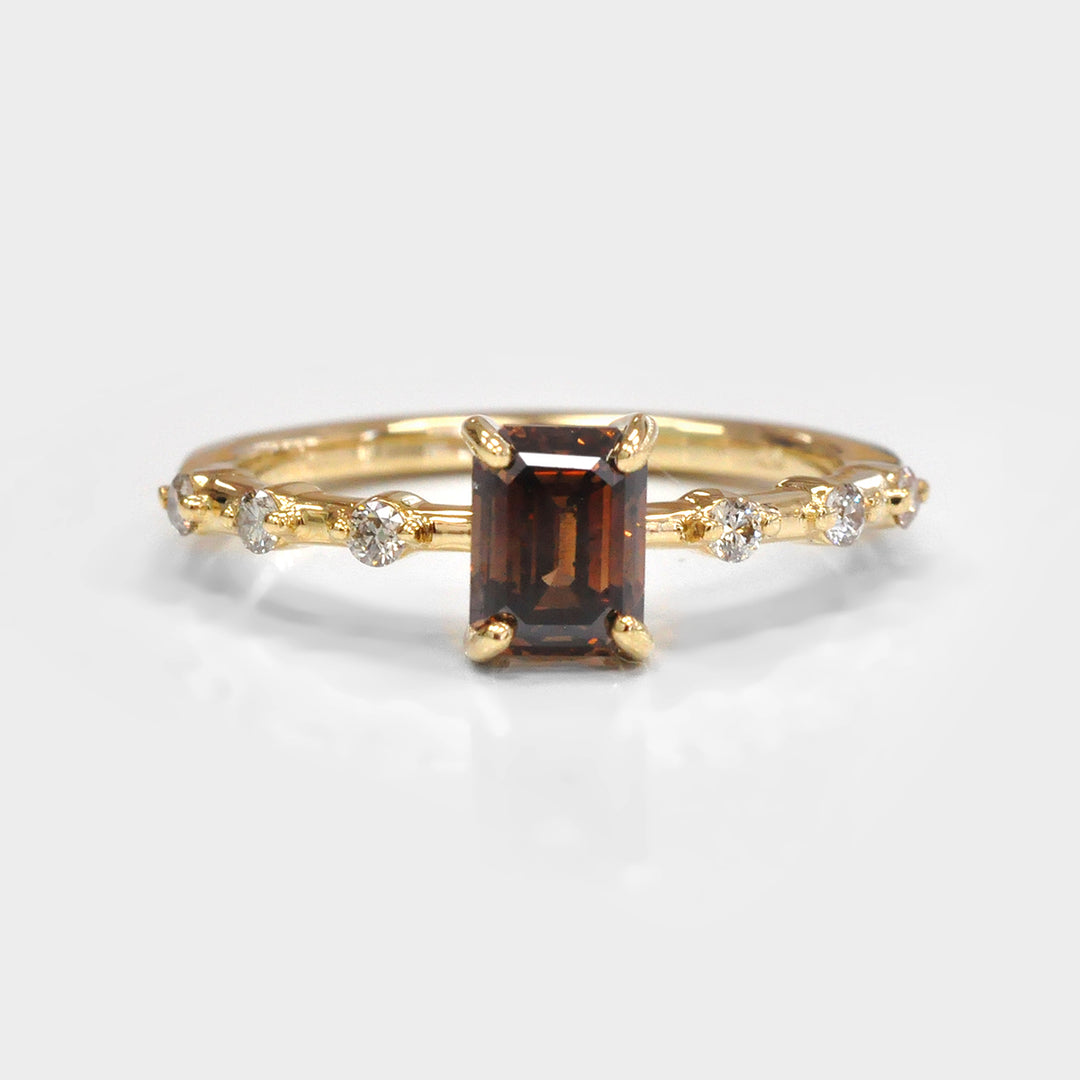 Delicate Emerald cut Diamond and 6 Side Diamonds Ring