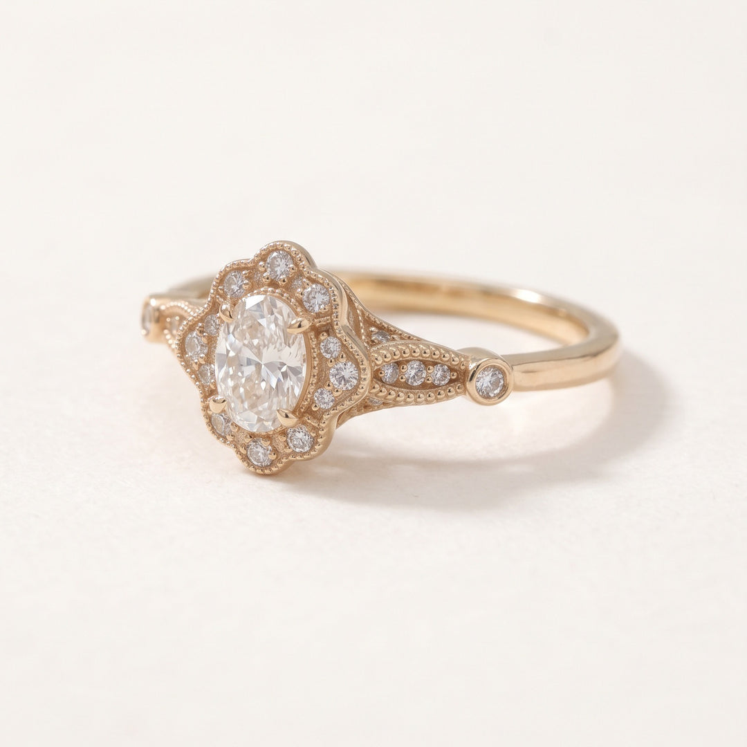 Vintage oval diamond halo ring in 14K rose gold / טבעת יהלום אובלי בהילה בסגנון וינטג׳ בזהב ורוד 14K - Angled view / מבט אלכסוני