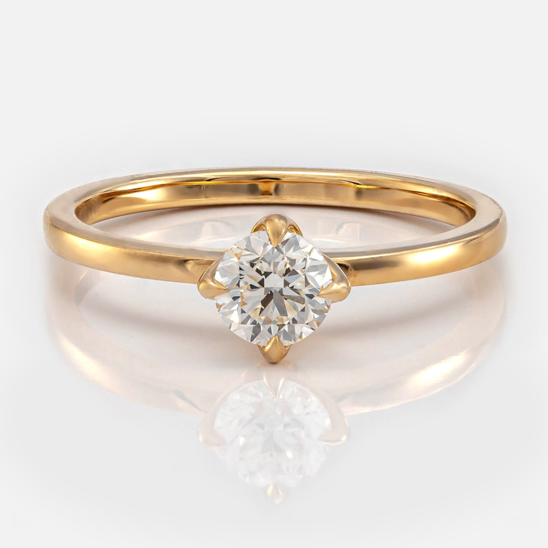 Delicate 4 prongs half carat diamond solitaire