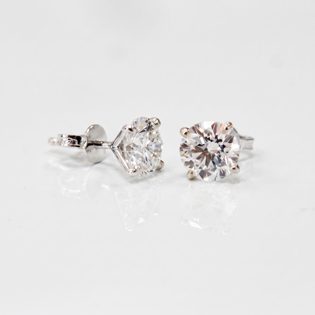 Lightweight martini natural diamond stud earrings in 14K white gold — side view and butterfly backs