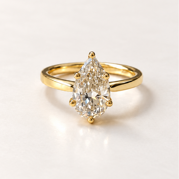 Pear diamond solitaire ring in 14K yellow gold — RS07814