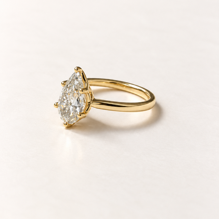 Pear diamond solitaire ring in 14K yellow gold — RS07814