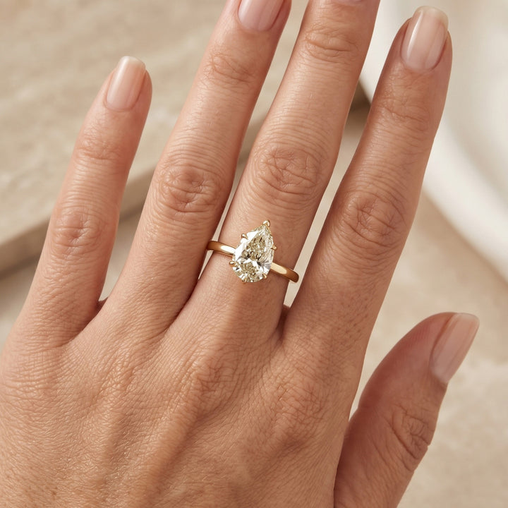 Pear diamond solitaire ring in 14K yellow gold — RS07814