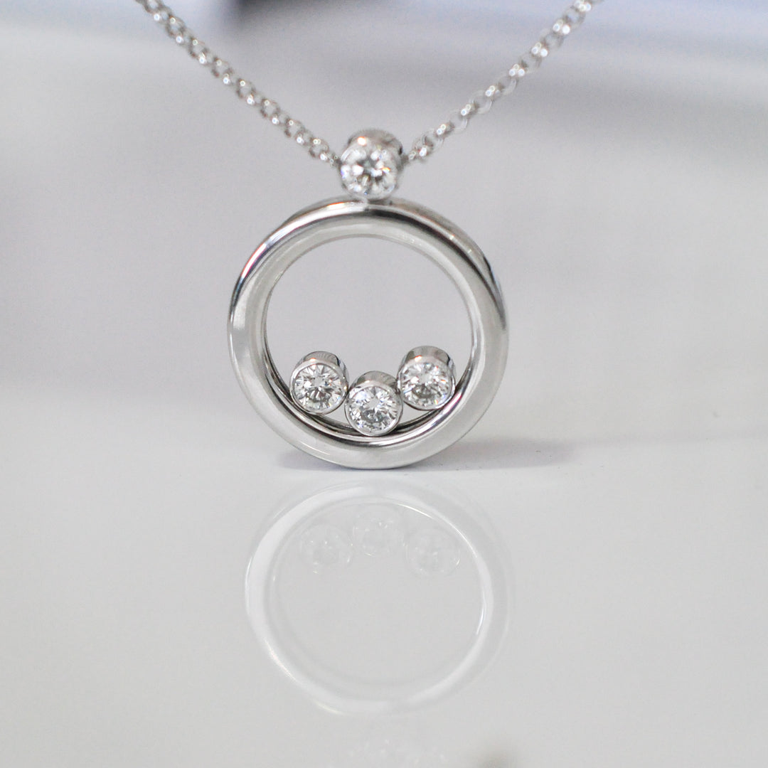 white Gold Circle 4 diamonds pendant