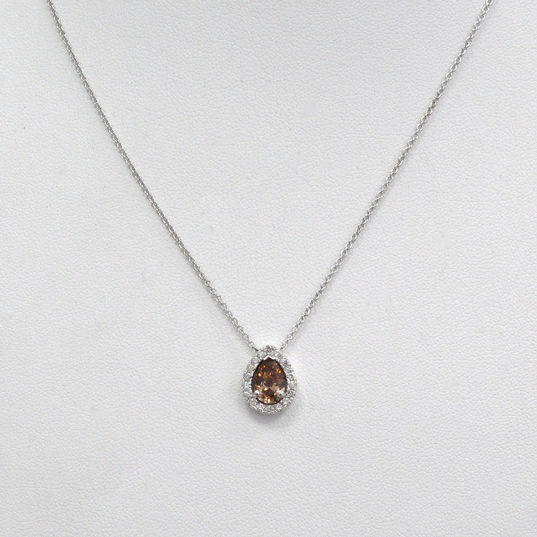 pear shape fancy brown and white diamonds halo pendant.
