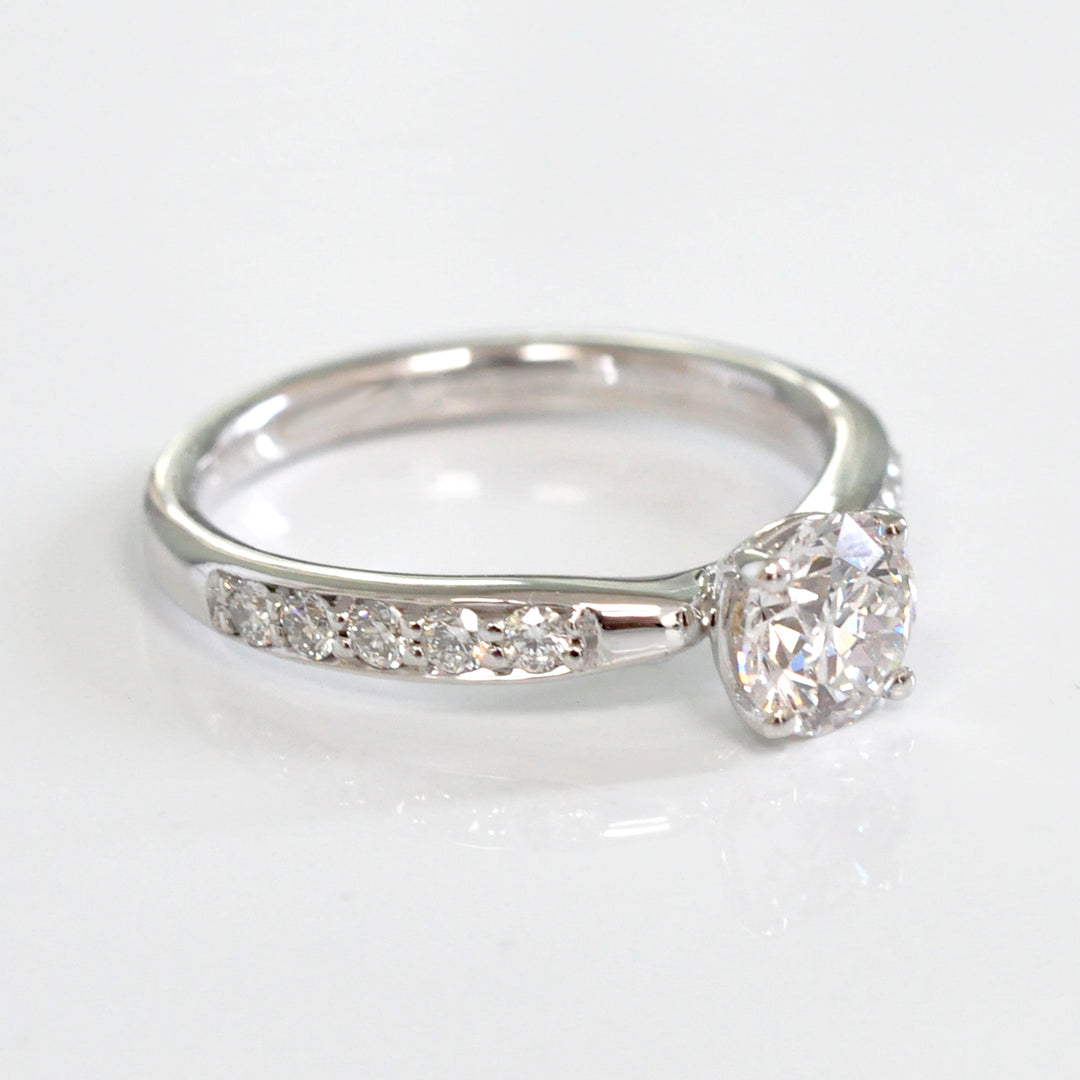 Center & side diamonds engagement ring
