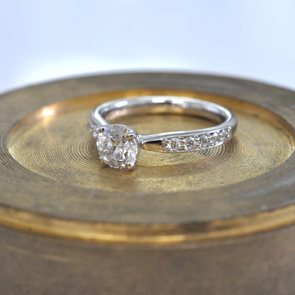 Center & side diamonds engagement ring