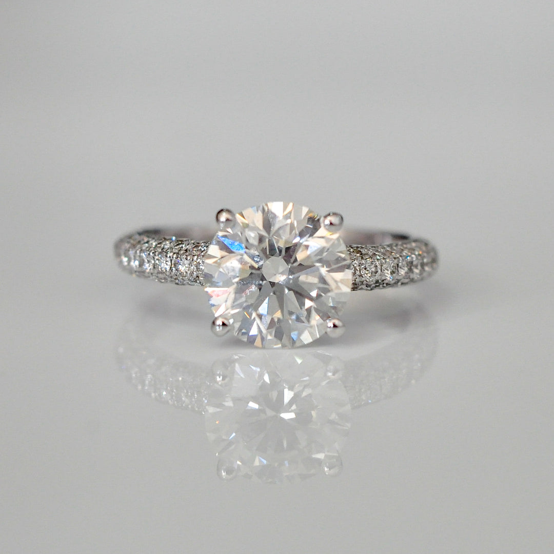 1.5 carat center diamond & 3 rows pave shank engagement ring