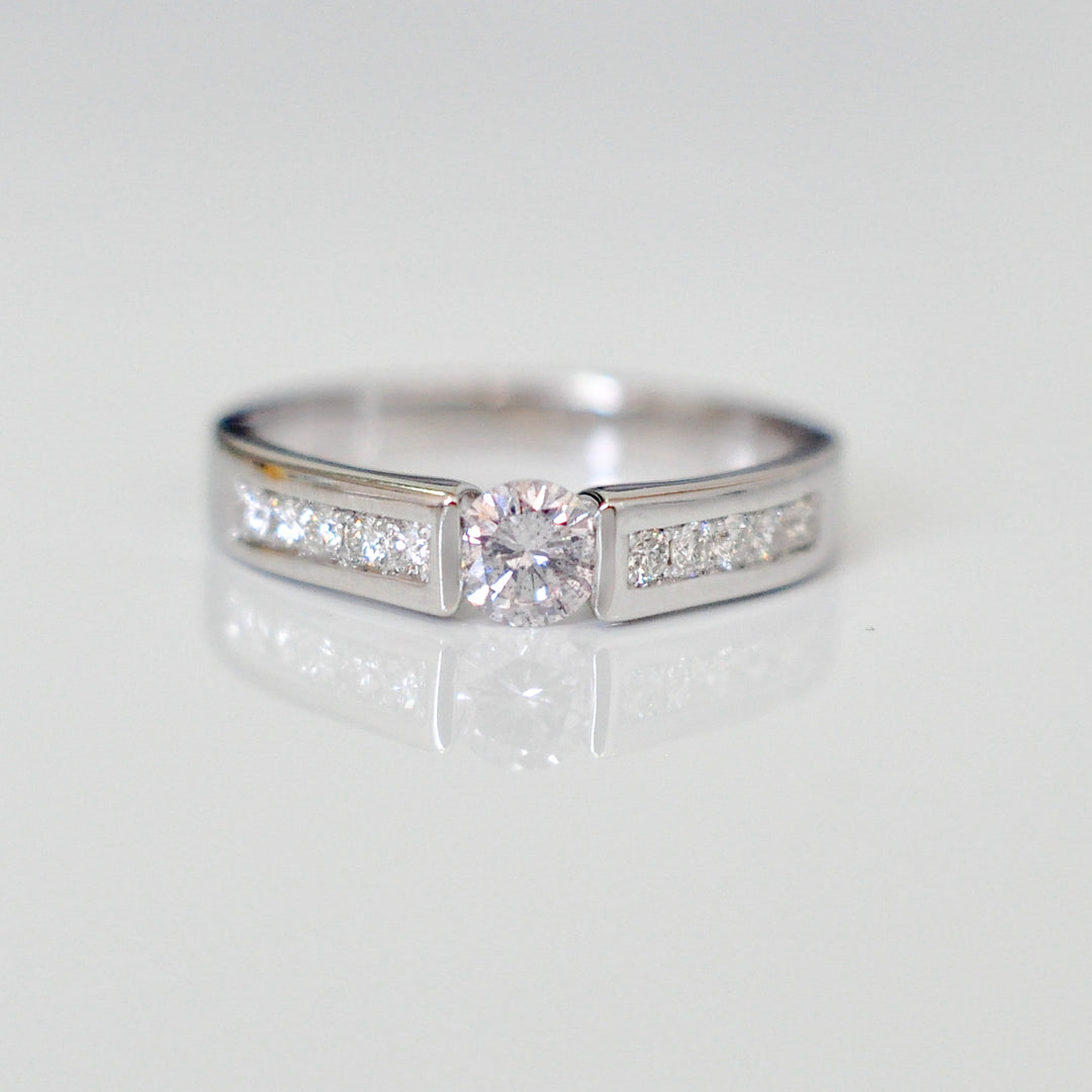 Channel Set 0.5 carat center diamond ring