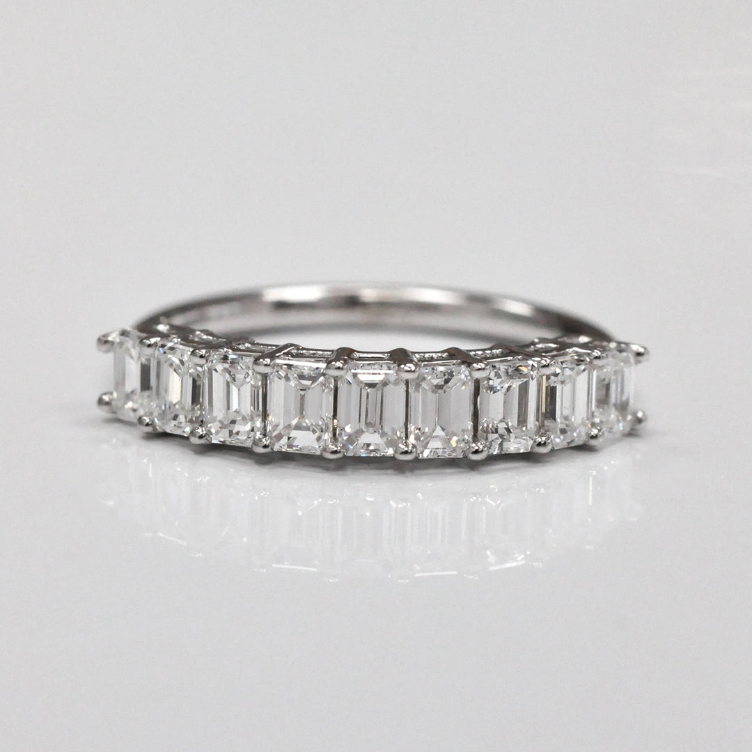 Nine baguette diamonds half eternity ring.